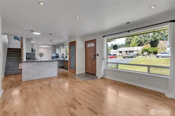 Light and Bright Living Room, with tiled foyer, spacious kitchen pantry and staircase leading up to the upstairs bedroom