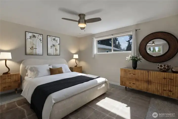 Master Bedroom gets lots of south facing light and you look out onto the grassy backyard.  Photo is virtually staged.