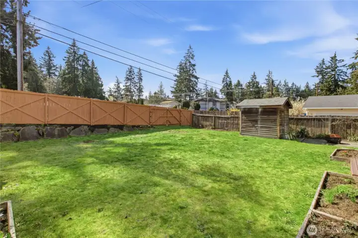 Fully fenced backyard is perfect for furry friends or for privacy.  The back fence has double gates if you wanted to store a small boat, trailer or jet ski in the backyard.  2nd shed is a perfect spot for wood or gardening equipment.
