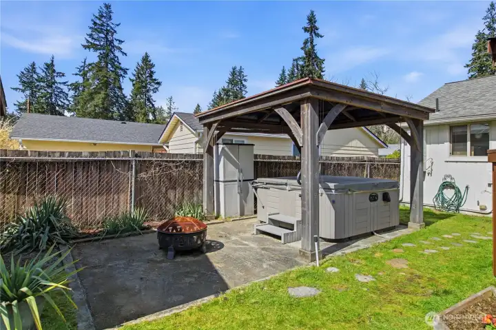 Relax in your hot tub under the gazebo.