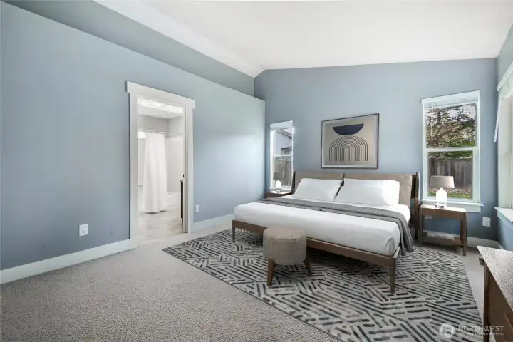 Another shot of the primary bedroom.  It has vaulted ceilings and a walk in closet.