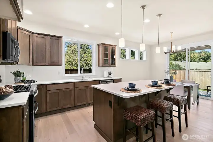Functional Kitchen with Quartz slab counters.