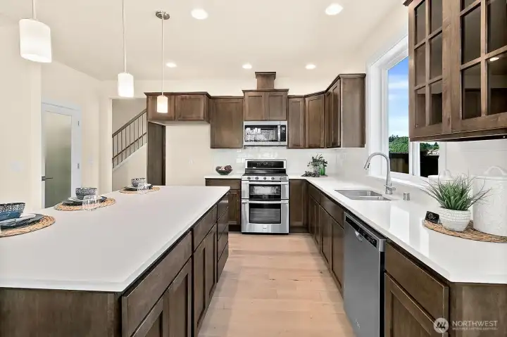 Tons of shaker cabinets. Stainless Appliances.