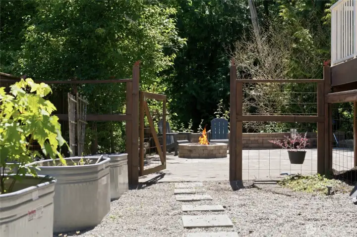 A gardener's delight with raised planting beds ready for flowers and fresh herbs.