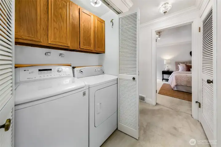 Washer and dryer in hall between two upper bedrooms