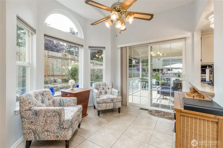 Another family room view, emphasizing the superb ambient lighting and back yard and kitchen access. There is also a fan/light for comfort Another family room view, emphasizing the superb ambient lighting and back yard and kitchen access. There is also a fan/light for comfort