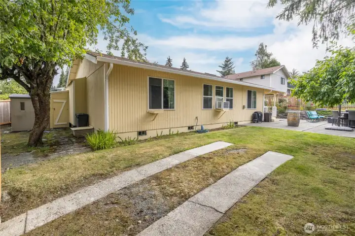 The backyard, including the RV parking slabs. The window air conditioner unit will remain with the home. The backyard, including the RV parking slabs. The window air conditioner unit will remain with the home.