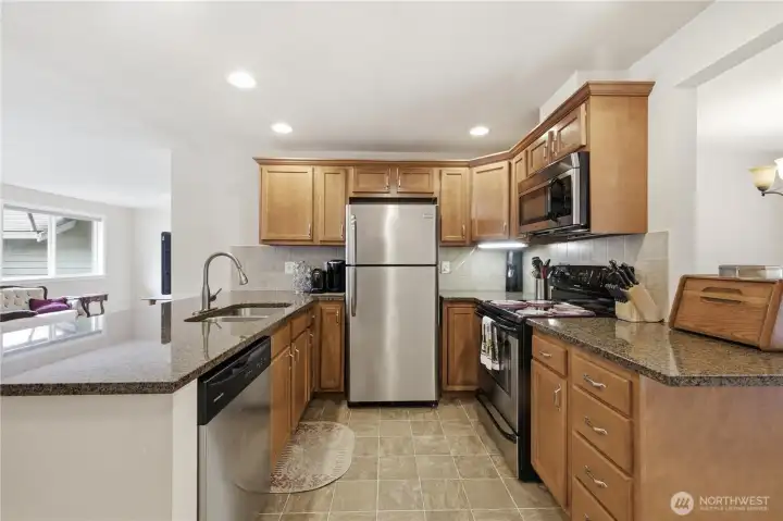 Kitchen opens up to living room and dining room Kitchen opens up to living room and dining room