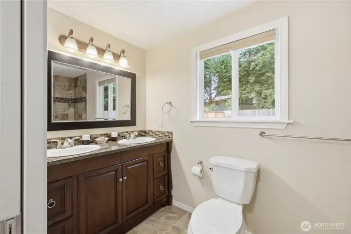 Primary bathroom with granite countertops Primary bathroom with granite countertops