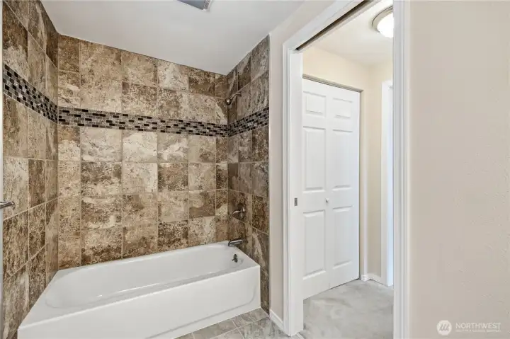 Primary bath and shower with custom tile Primary bath and shower with custom tile