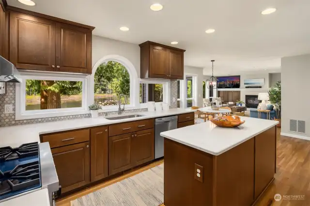 Indulge your culinary passions in the  gourmet kitchen, recently remodeled with  upgraded cabinetry, countertops, backsplash,  and modern appliances.