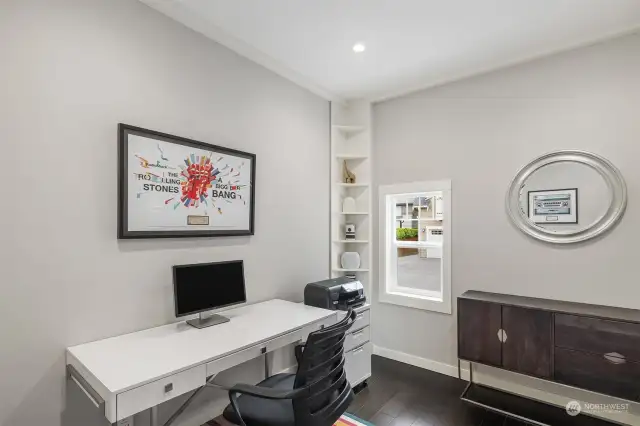 Working from home is a breeze in this fabulous home office.  Ideally tucked down the hall from the kitchen, it is a quiet place to get work done from home!