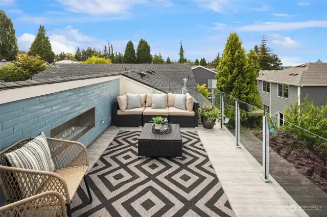 The rooftop deck is easily accessed from the bonus room and you will absolutely love it! The oversized fireplace is as beautiful as it is functional and the views of Lake Washington and downtown Kirkland are absolutely amazing!  The views are so good, the sellers even have 4th of July parties to enjoy the firework show in downtown Seattle!