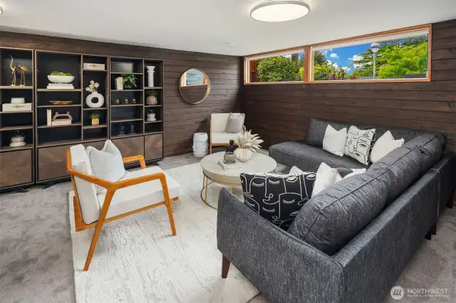 Lower floor recreation room with built in bookshelves