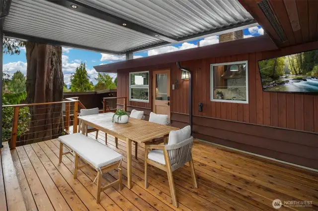 Covered deck with motorized louvered pergola, heater & TV