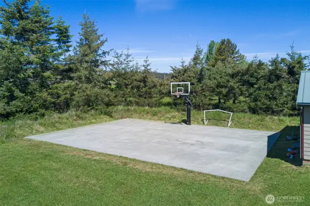 Sport Court located behind the two car garage.