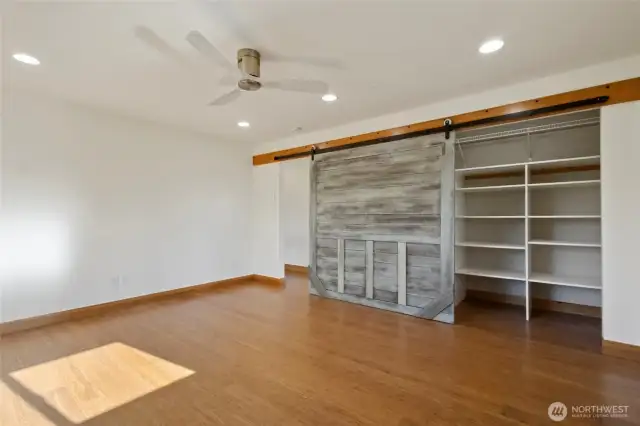 Bonus room upstairs closet with barn door