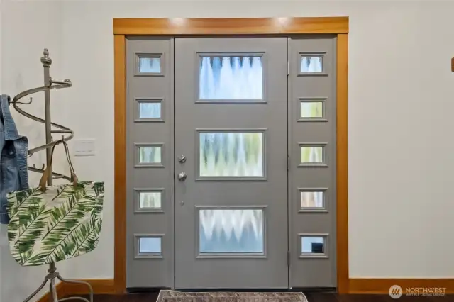 Custom front door allowing a lots of light to your main level
