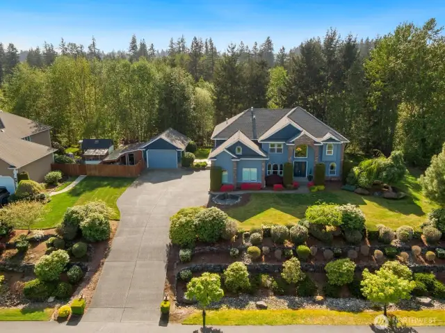 Welcome home to this stunning estate in The Bluffs in Bowman Lake Estates in Lake Tapps!
