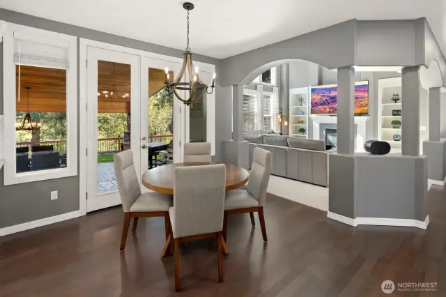 Eating area off of the kitchen.  Open concept floor plan with views of the lush backyard and family room!