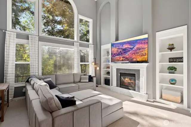 Soaring ceilings, generously sized windows & cozy gas fireplace!