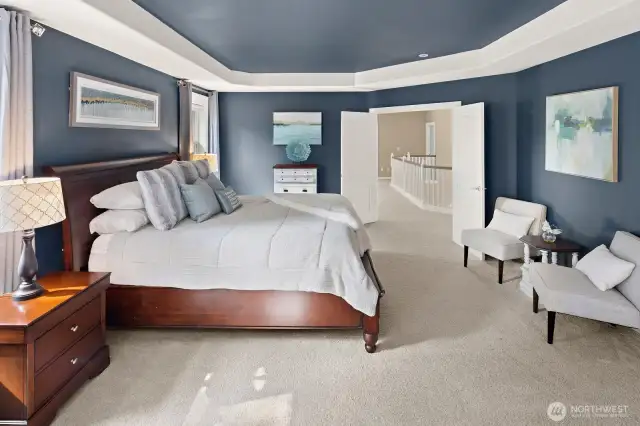 Spacious primary bedroom suite.