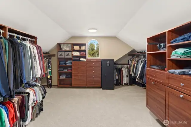 Dream closet with custom closet organizers and so much space!   A window adds natural light,  The possibilities here are endless!