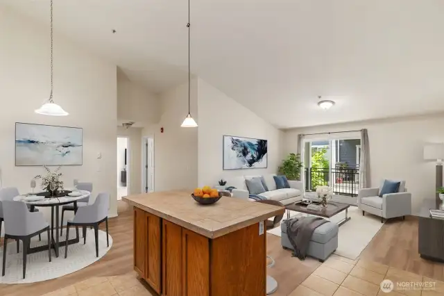 (virtual staging) There's room in the Dining Area for a round or oblong table with additional seating at the Kitchen island. And the spacious Great Room offers endless options for Living Room furniture arrangement.
