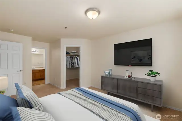 The spacious Primary Suite boasts plush, new carpeting, a full Bathroom AND a walk-in closet! (virtual staging)