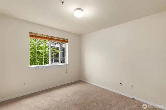 Bedroom #2 with plush new carpeting and a full closet.