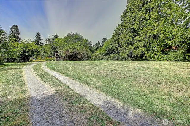 Private drive into your 1 acre property!