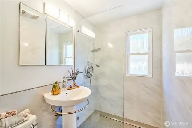 Updated bathroom tile floor, surround, & walk-in shower.