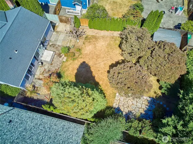 Full view of back yard with alley access.