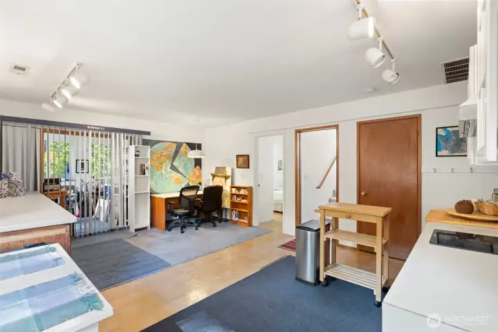 Standing near the kitchen looking back at all the space in this room.