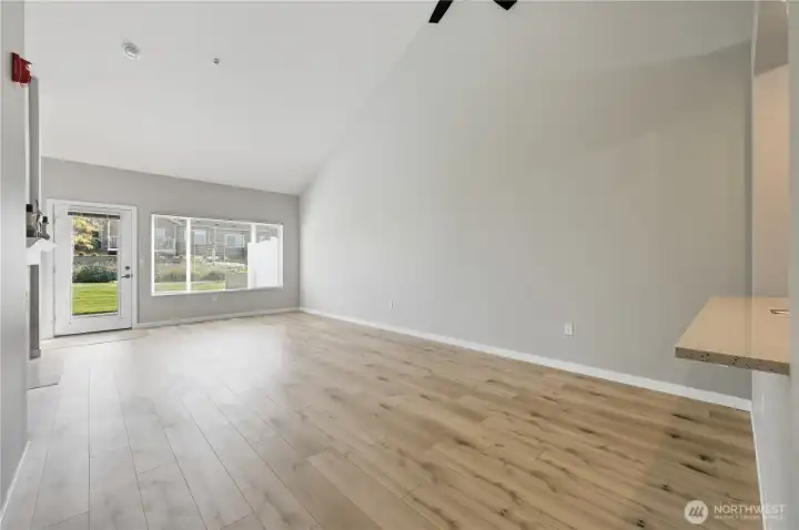 Great room with vaulted ceilings and light