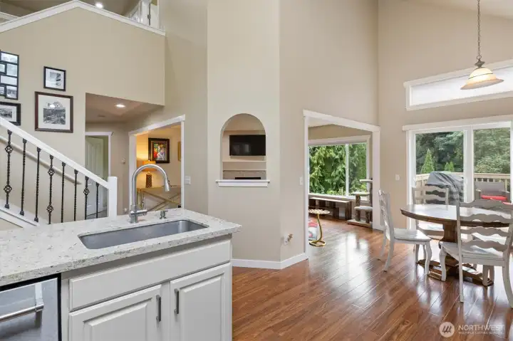 Soaring ceilings in open kitchen to living room layout