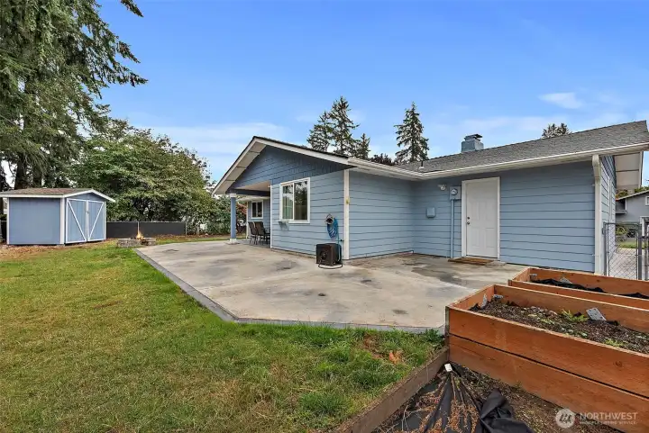 Raised Garden Boxes, Outdoor Shed, Fully Fenced Yard, & Poured Patio on an 8,000 Sq Ft Corner Lot!