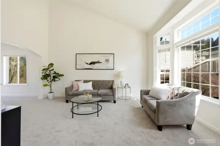 Soaring ceilings and expansive windows fill the home with beautiful natural light and highlight the thoughtful updates throughout.