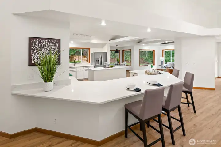 An oversized and exquisite island in the kitchen adds ease to entertaining.