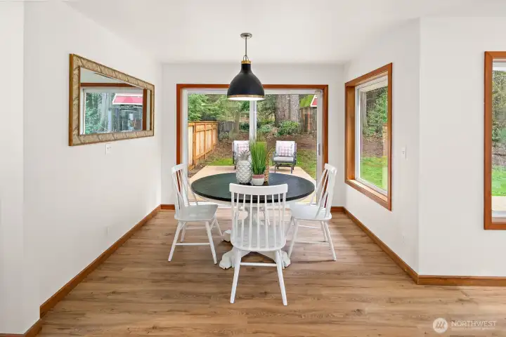 The breakfast nook opens to another relaxation area on the expansive deck!