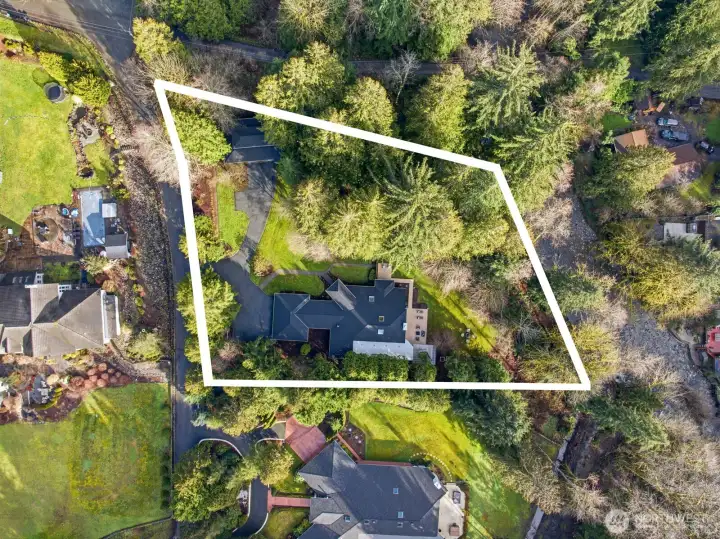 Lush and beautifully landscaped 1.39 acres above the river!