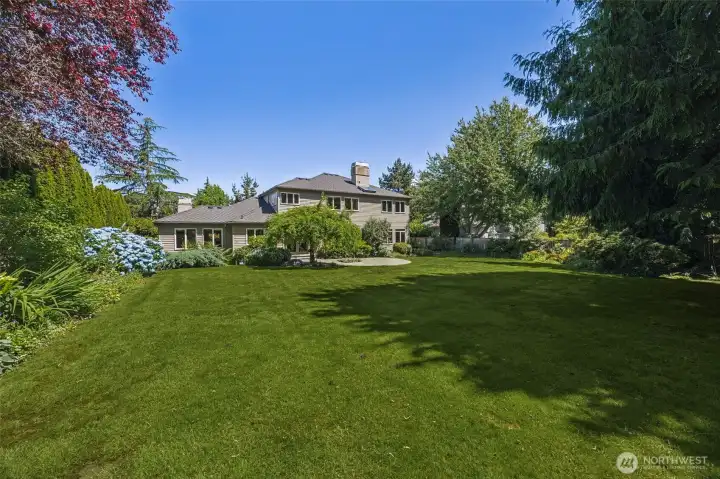 The backyard is spacious and private, surrounded by mature landscaping. The backyard is spacious and private, surrounded by mature landscaping.