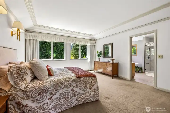 The Primary Suite is quite spacious and overlooks the lovely backyard. The Primary Suite is quite spacious and overlooks the lovely backyard.