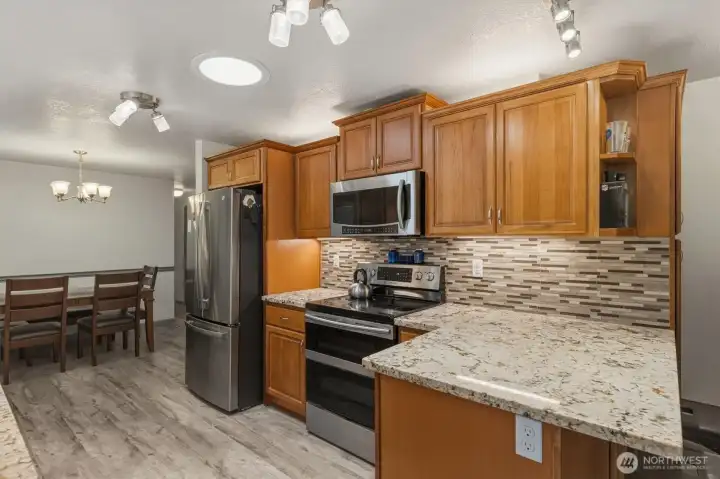 Granite counters and solar tube in kitchen