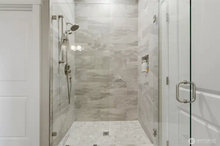 On suite tile shower.