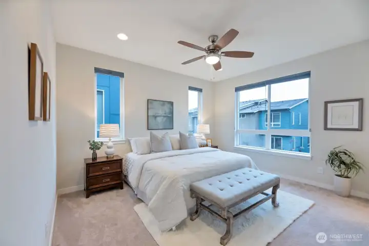 Master suite with stylish ceiling fan for year-round comfort