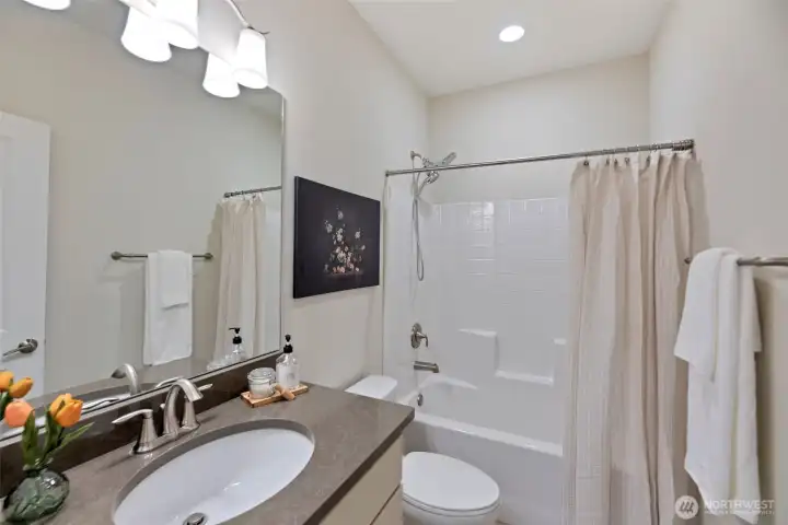 Upper level hallway bath with tub