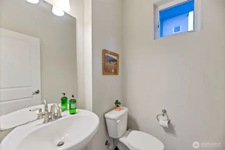 Powder room off kitchen/dining/great room