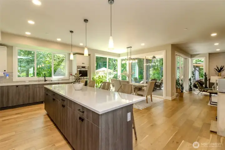 The kitchen is open to the great room with two sets of sliding glass doors leading to the covered patio.