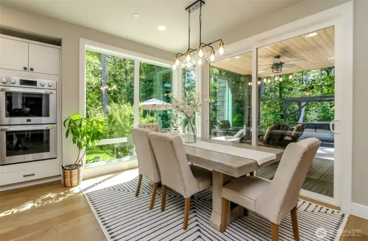 Seller upgraded the light fixtures after moving in, such as you will notice in the dining room.  The sliders lead to the covered back patio which has an oversized patio.
